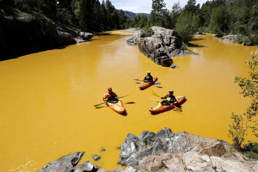 Kayakers in the Animas River near Durango, Colorado, after the spill. Credit: Jerry McBride/The Durango Herald via AP