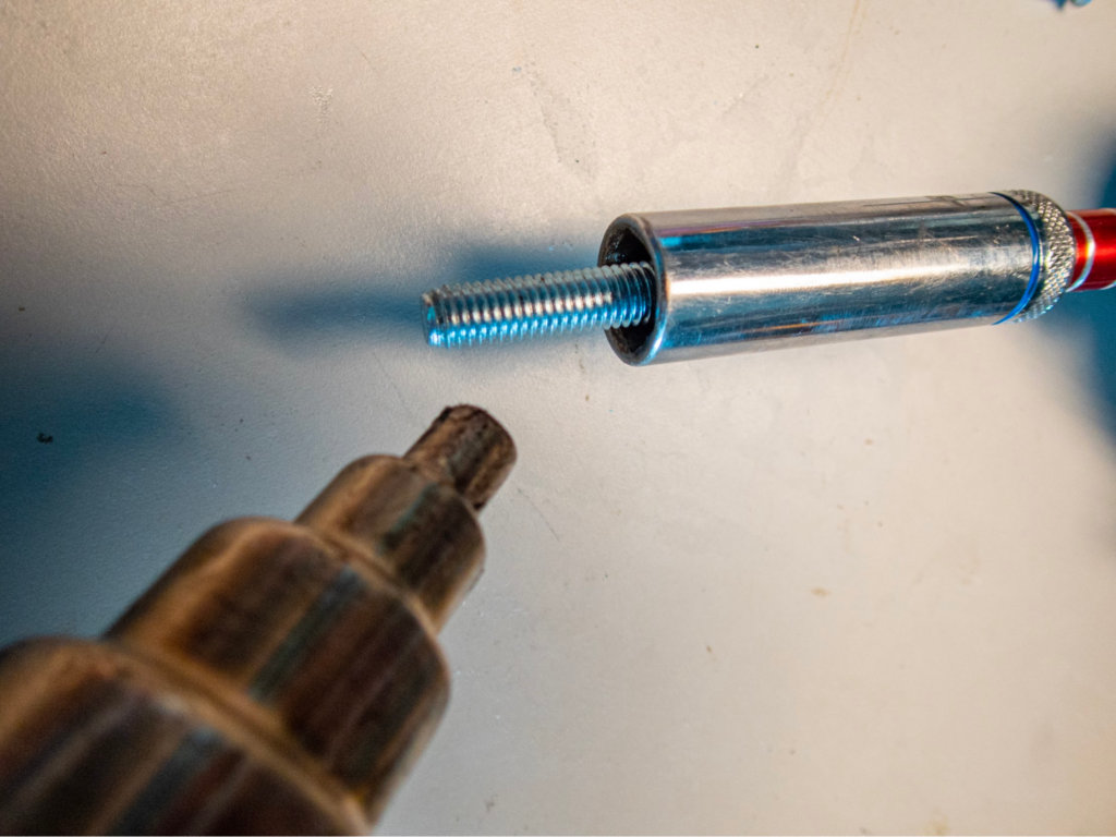 Heating bolt to tap planet bearing threads