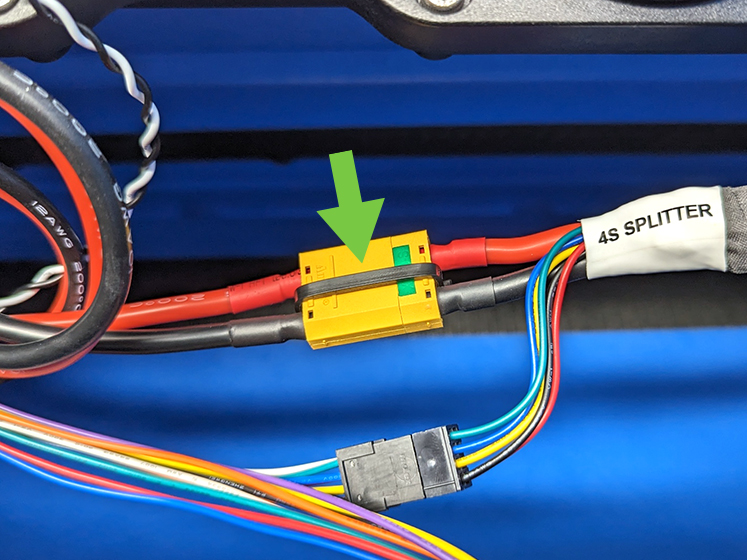 Cable tie installed around splitter cable connector.