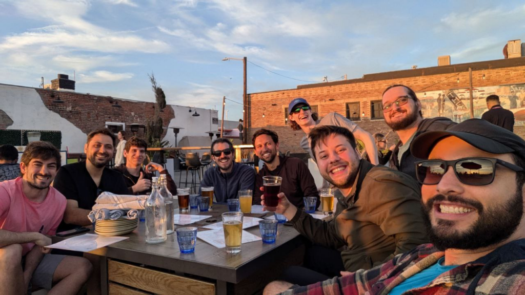 Blue Robotics software team sitting around a table smiling